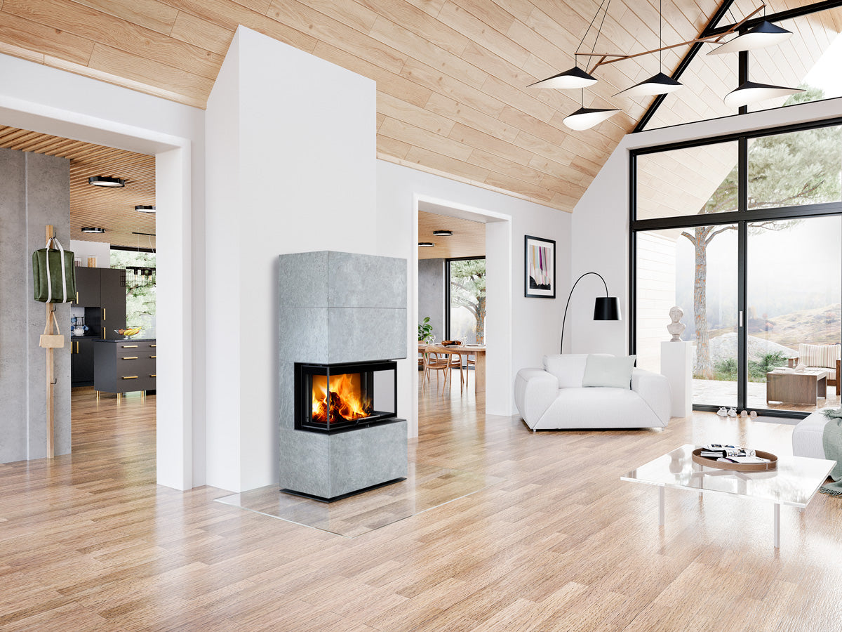 Semineu modular placat cu piatra serpentin gri, geam cu trei laturi instalat in living cabana la munte, design modern